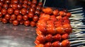 Strawberry and tomato glazed stick in Taiwan night market Royalty Free Stock Photo