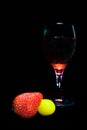 Strawberry tomatoes and glass of red wine