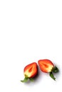 Two halves of Strawberry berries on a white background with copy space for greeting card. Royalty Free Stock Photo