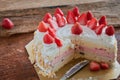 Strawberry And Vanila Ice Cream Cake With Fresh Strawberry Topping On Wooden Table