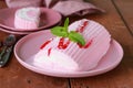 Strawberry vanilla cake roll ice cream with mint Royalty Free Stock Photo