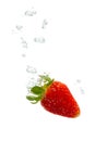 Strawberry in water with air bubbles