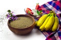 Strawberry with whipped cream and cinnamon stick, chia flour in a wooden bowl and baby bananas Royalty Free Stock Photo