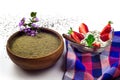 Strawberry with whipped cream and cinnamon stick, chia flour in a wooden bowl Royalty Free Stock Photo