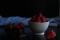 Strawberry white bowl photo with dark background
