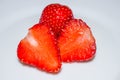 Pieces of strawberries on white plate