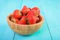 Strawberry Wood Bowl On Blue Background Royalty Free Stock Photo