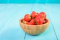 Strawberry Wood Bowl On Blue Background Royalty Free Stock Photo