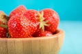 Strawberry Wood Bowl On Blue Background Royalty Free Stock Photo