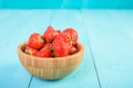 Strawberry Wood Bowl On Blue Background Royalty Free Stock Photo