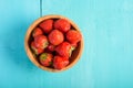 Strawberry Wood Bowl On Blue Background Royalty Free Stock Photo