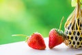 Strawberry on wood and round bamboo basket