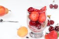 Strawberry yogurt with berries, French cracker and muesli on a bright table, fruit salad. Healthy breakfast with ingredients,