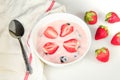 Strawberry Yogurt in the bowl on the white table