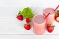 Strawberry smoothies yogurt juice and strawberry fruit for breakfast in the morning on white wood background. Royalty Free Stock Photo