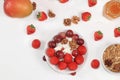 Strawberry yogurt, granola, cottage cheese, fresh berries, mangoes, strawberries and grapes on a light table. The concept of Royalty Free Stock Photo
