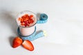 Strawberry yogurt smoothie with measure tape Royalty Free Stock Photo