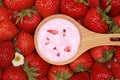 Strawberry yogurt on a spoon Royalty Free Stock Photo