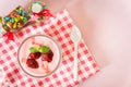 Strawberry yogurt with strawberry on pink background. strawberry yoghurt. pink yogurt. strawberry in strawberry yogurt. heart in