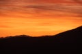 Streaking Orange Clouds Over Ridge Royalty Free Stock Photo