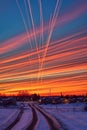 streaks of airplane contrails crisscrossing the sky at dusk