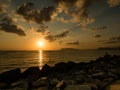 Coastal clouds illuminated with the rising sun, Palermo, Sicily, Italy.