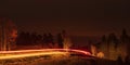 red streak of car lights at night Royalty Free Stock Photo