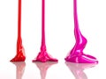 Streaks of multi-colored nail polish or paint in the form of drops on white background. Nail polish dripping. Liquid