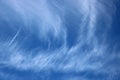 Streaks of wispy white clouds in blue sky Royalty Free Stock Photo