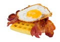 Streaky Bacon Rashers And Fried Egg On A Potato Waffle Royalty Free Stock Photo