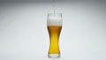 Stream beer pouring glass in super slow motion close up. Wheat alcohol liquid. Royalty Free Stock Photo