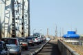 A stream of cars on the old bridge in Astrakhan Royalty Free Stock Photo