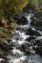 Stream cascading over rocky stream bed, Cumbria UK