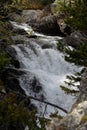 The stream crashes down the mountain slope in controlled chaos Royalty Free Stock Photo