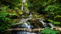 Stream or creek flowing between mossy rocks, water, autumn, Ireland Royalty Free Stock Photo