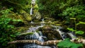 Stream or creek flowing between mossy rocks, water, autumn, Ireland