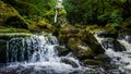 Stream or creek flowing between mossy rocks, water, autumn, Ireland