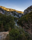 Stream flowing through the hiking area Sentier Blanc-Martel with trees under the clear sky Royalty Free Stock Photo