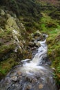 Stream with flowing water over rocks Royalty Free Stock Photo