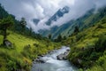 A stream flows through a vibrant green valley surrounded by mountains and vegetation, A serene mountain valley with a flowing Royalty Free Stock Photo