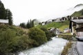 Stream and Glacier from Alps highest and most extensive mountain range flowing passed at Villages Royalty Free Stock Photo