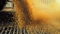 Stream of golden wheat cascading down at manufactory