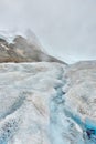 Stream of melted snow on the glacier along the Icefields Parkway between Banff and Jasper in the Canadian Rockies Royalty Free Stock Photo