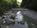 Stream in a natural area in Upper Bavaria with barrages and large stones at sunrise Royalty Free Stock Photo