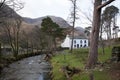 A stream passing a house in the Buttermere Valley, Cumbria in the UK Royalty Free Stock Photo