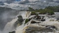 A stream of swirling water rushes along the rocky riverbed