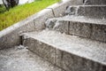 The stream of water flows down from the steps of the stairs.