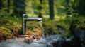 A stream of water flows from a faucet into another stream of water in a display of water conservation and the importance of saving Royalty Free Stock Photo