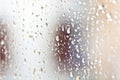 Stream of water in heavy rain. Raindrops on window pane. Royalty Free Stock Photo