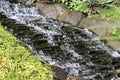 Stream of water in apond Royalty Free Stock Photo